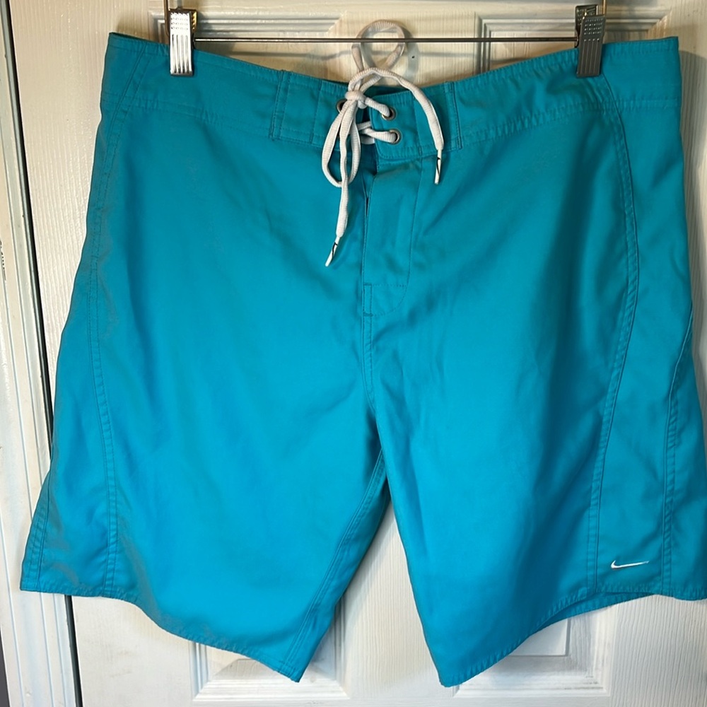 Nike teal swim trunks with drawstring and Velcro closure NWOT Large